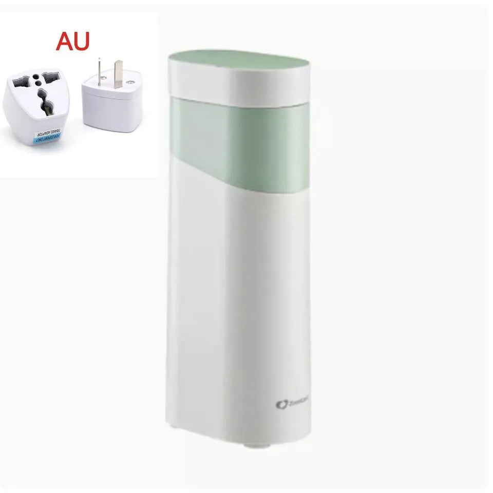 Small black portable instant water dispenser or travel kettle on a desktop.
