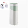 Small black portable instant water dispenser or travel kettle on a desktop.