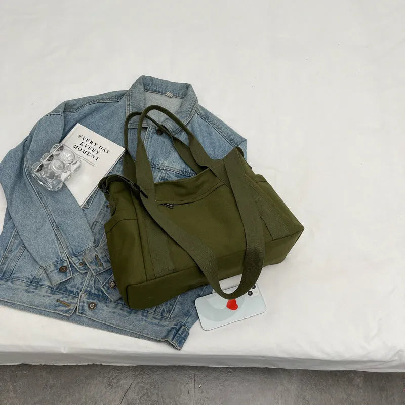 Women's polyester shoulder bag in solid colour with external pocket and internal phone compartment