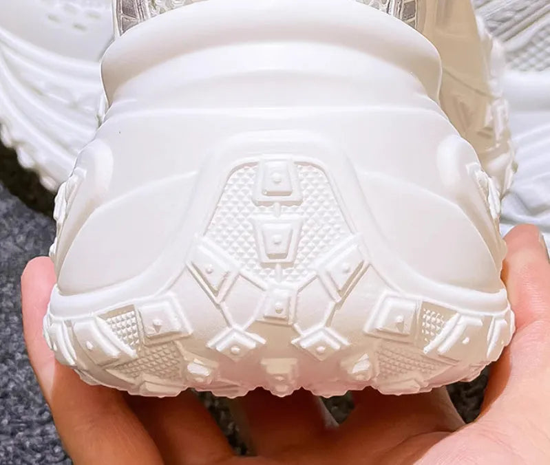 White women's height increasing dad shoes with lace-up closure and round toe, showing internal lift construction