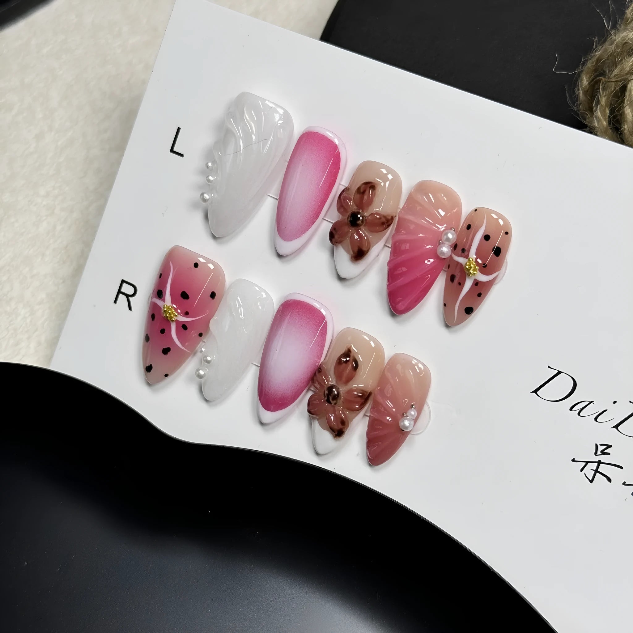 Hand-painted three-dimensional carved nail beauty patches showing embossed and candy patterns on almond-shaped nails