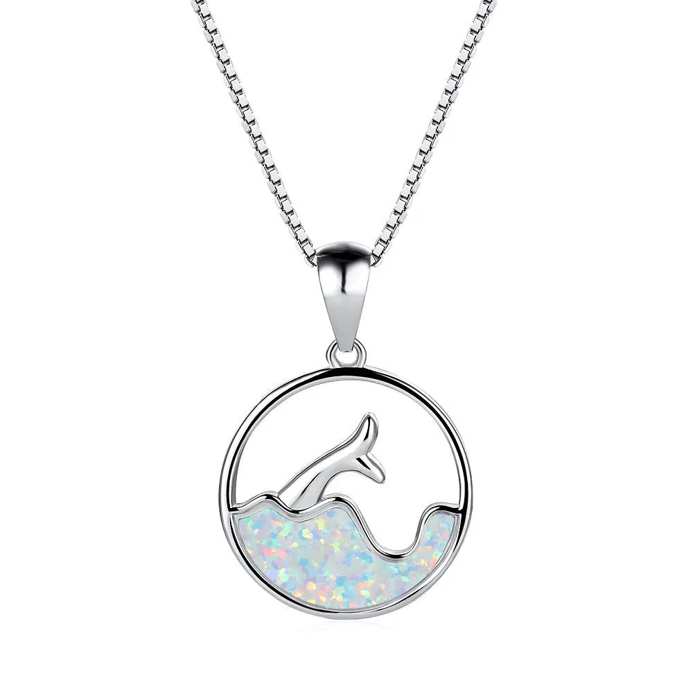 White gold geometric fishtail necklace with a round blue opal pendant on an adjustable chain.