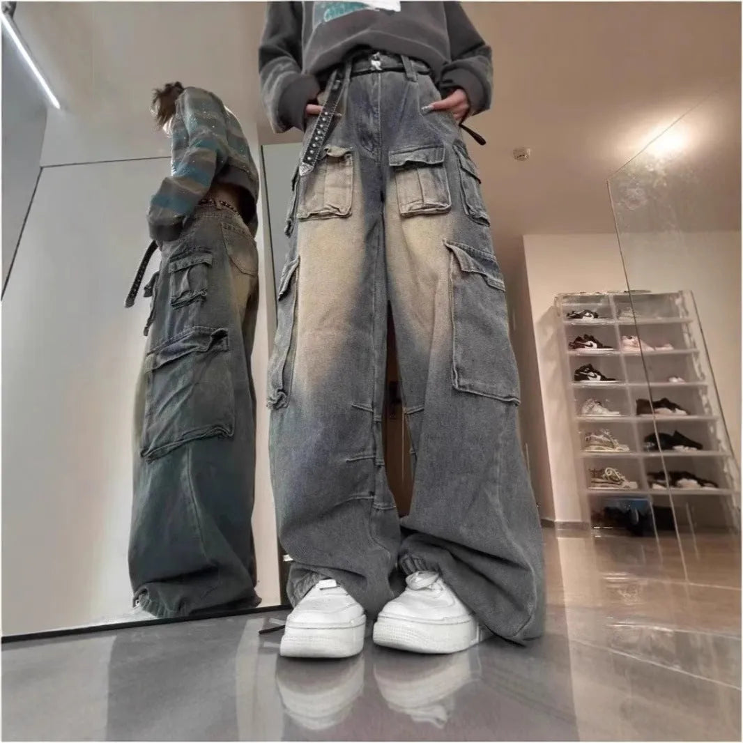 Loose-fit distressed denim jeans with multiple tooling pockets in light blue colour