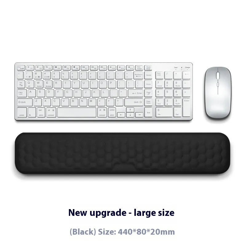 Memory foam mouse wrist rest pad with silicone base in black cloth cover option on desk