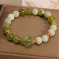 Xiuyan jade green Mori-style women's bracelet on a wrist.