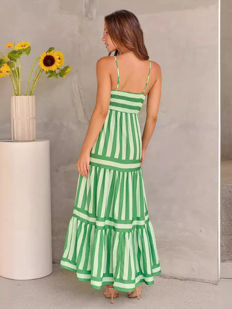 Long striped backless dress with square neck, side pockets, and adjustable suspender straps.