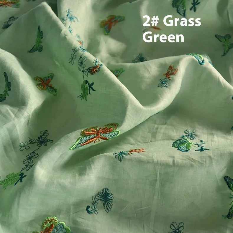 100% ramie embroidery fabric showing texture in beige, dark green and grass green colours