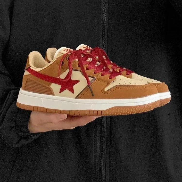 Brown women's low-top platform sneakers with sequin details and a lace-up front.