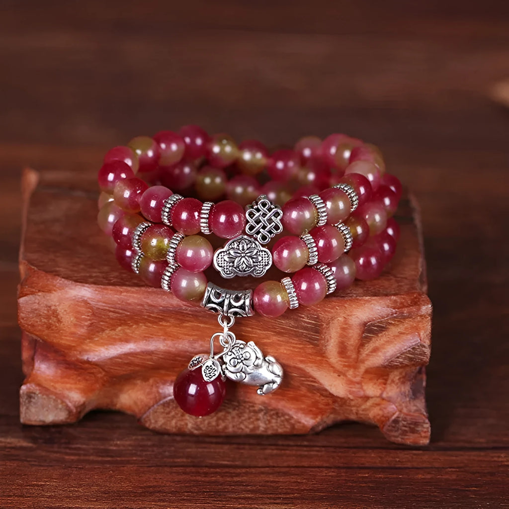 Handmade natural watermelon crystal bracelet with Chinese knot closure in geometric national style design