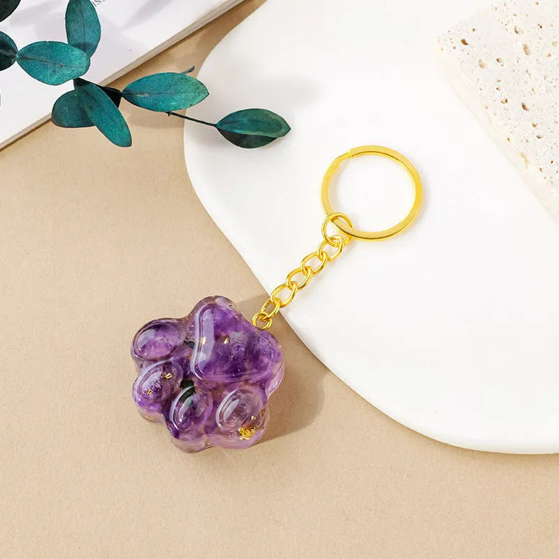 Natural crystal cat's paw keychain pendant charm in one of ten crystal types including pink crystal and amethyst.