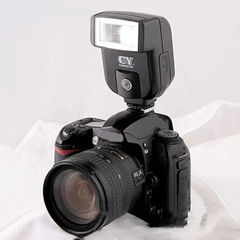 SLR camera flash accessory with upward tilt feature showing compact design and hot shoe mount
