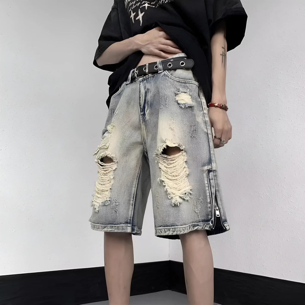 Blue retro tattered denim shorts with a wide leg loose fit on a mannequin