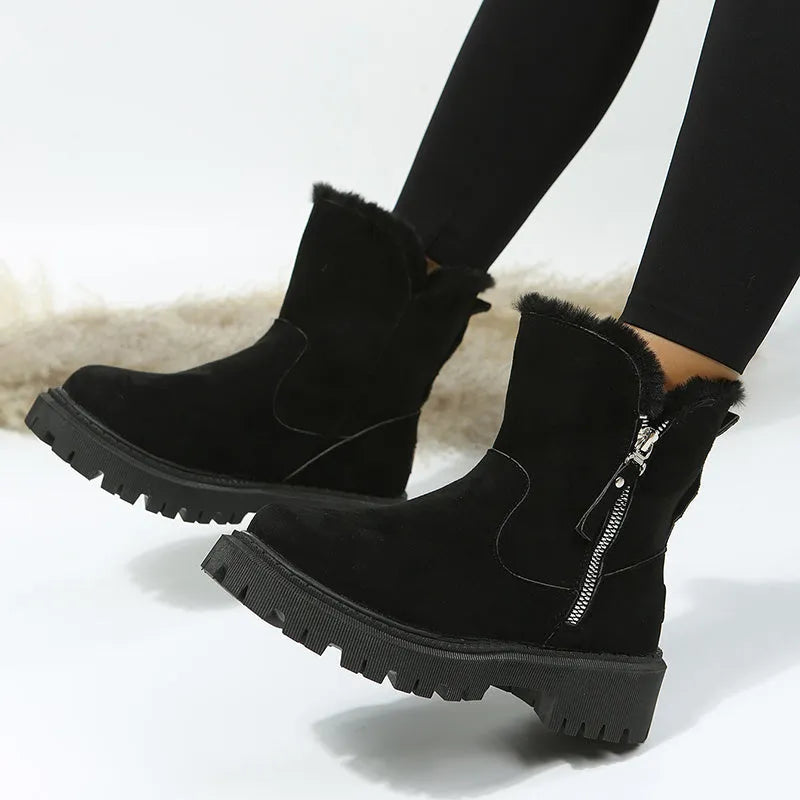 Women's black high-top snow boots with side zipper and thick plush lining on a winter background.