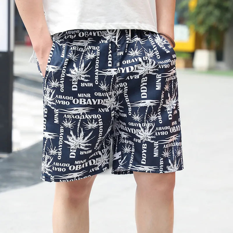 Men's printed five-point swimming trunks with floral pattern in polyester fabric