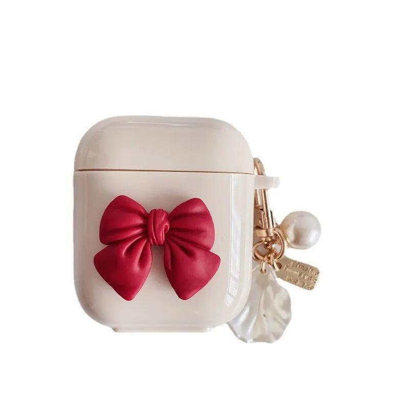 Beige and red bow shell design TPU silicone protective case for AirPods Pro charging case.