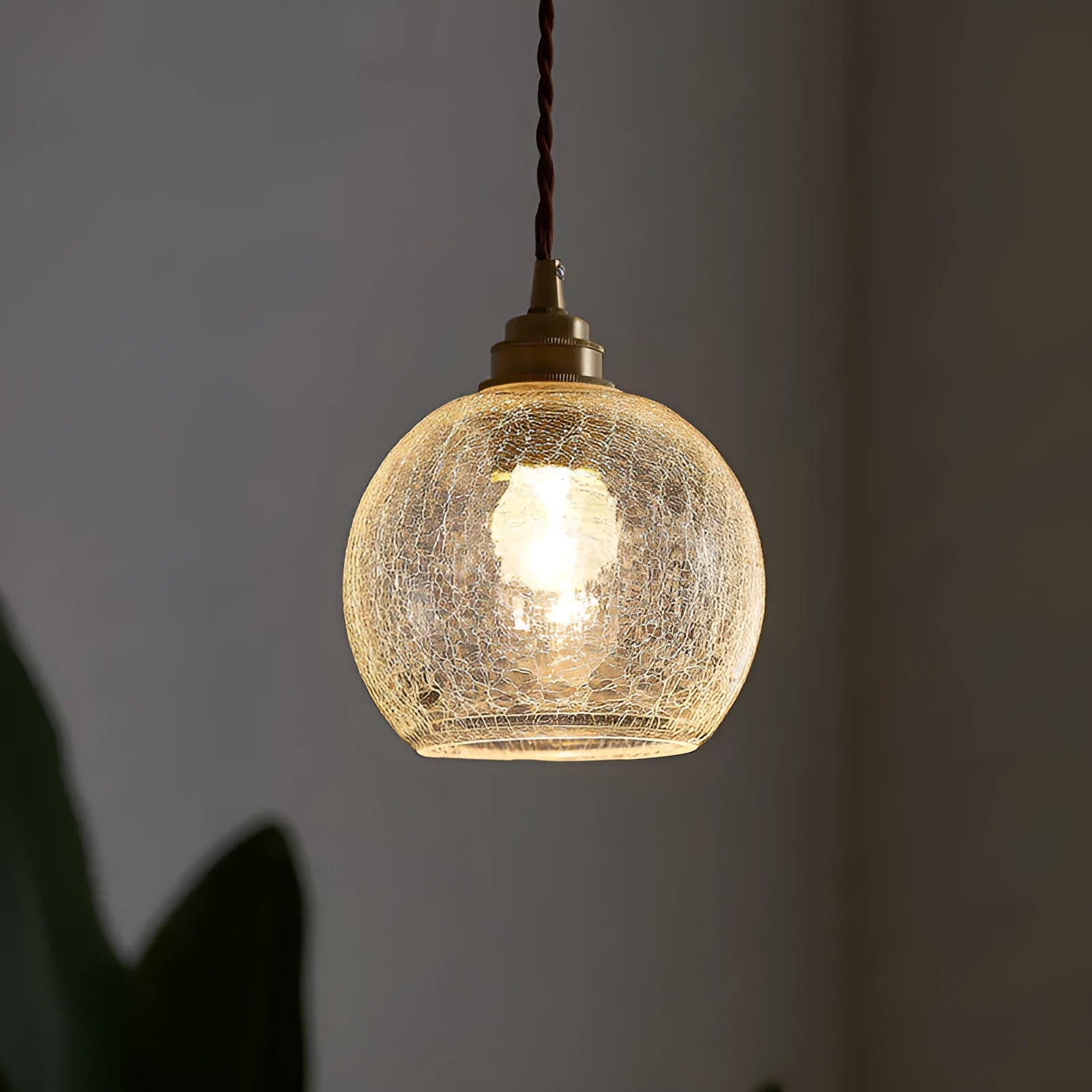 Brass chandelier with glass ball shades measuring 17.5cm wide, showing electroplated copper construction