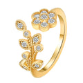 Women's open ring with diamond flower and leaf pattern in copper, shown in gold and white colour options.