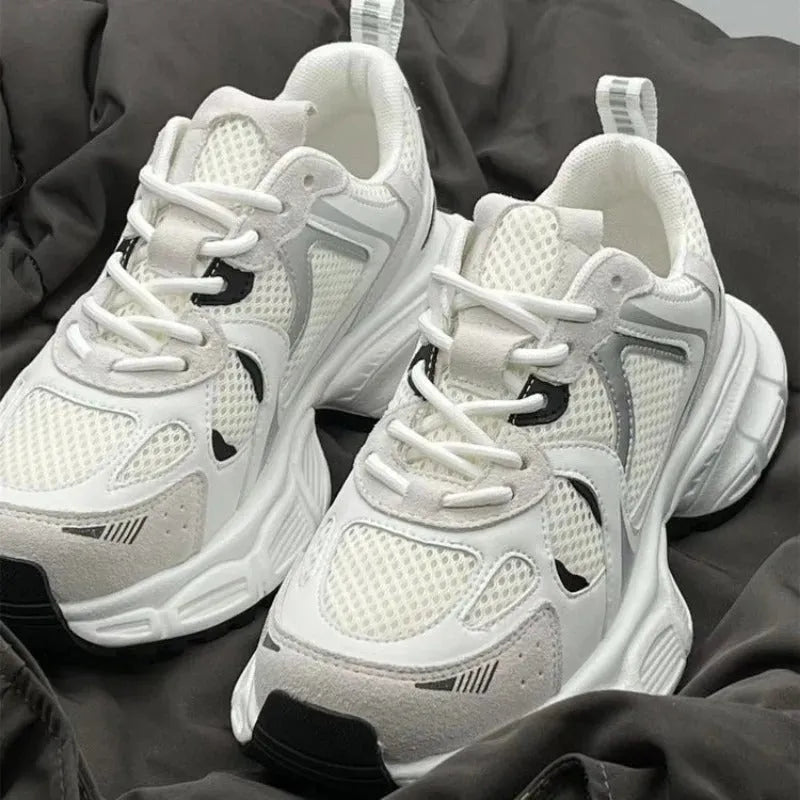 Beige mesh platform shoes with wedge heel and front lace-up closure on rubber sole