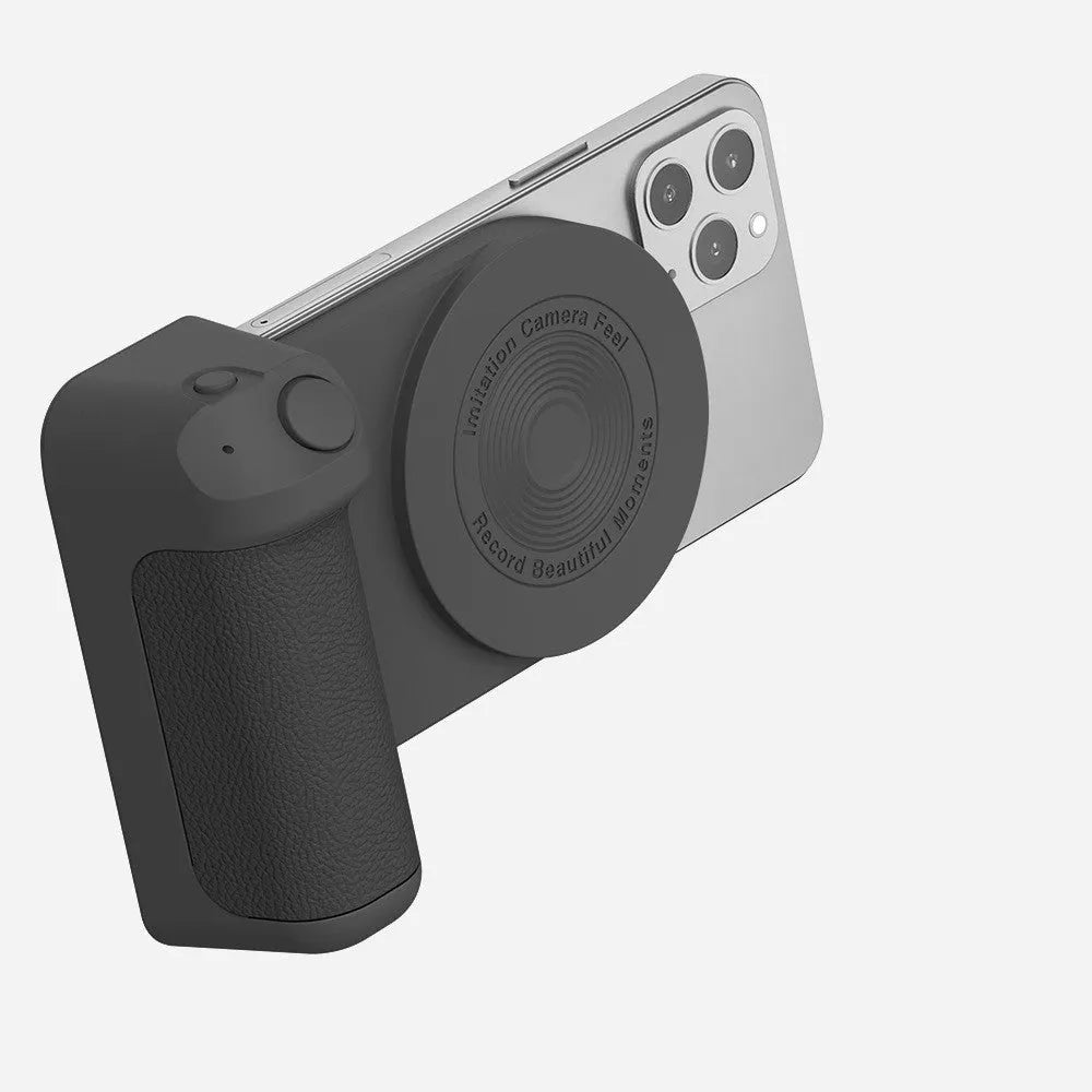 Black magnetic camera grip phone holder with wireless charging and PU leather handle on wooden surface