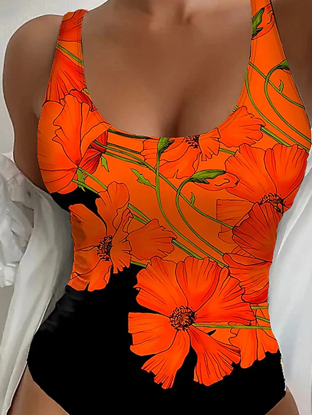Orange floral print backless one-piece swimsuit on a hanger