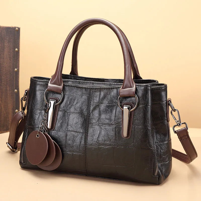 Horizontal square PU leather shoulder bag with single strap showing internal organiser compartments