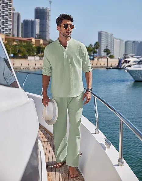 Men's solid colour cotton suit with long sleeve top and trousers in beige, shown laid flat