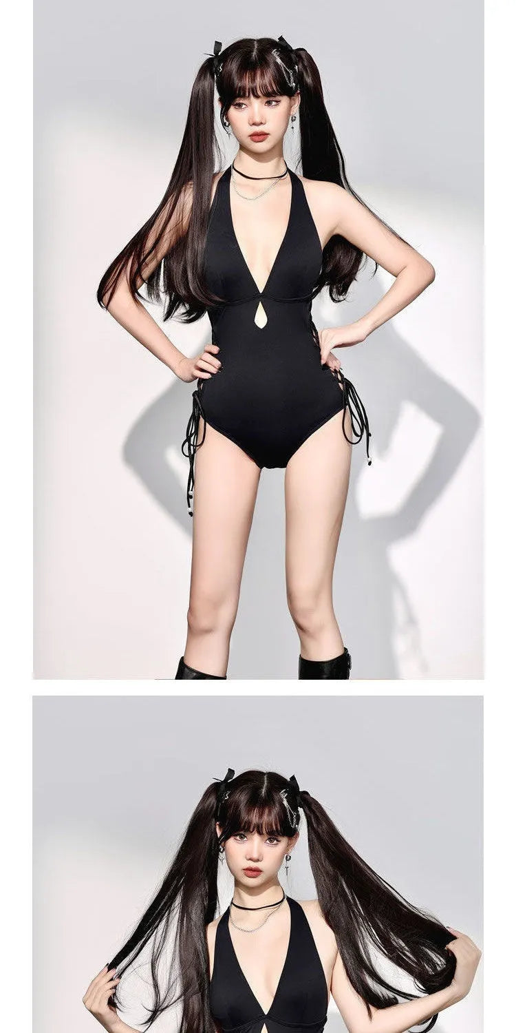 Women's V-neck hollow strap one-piece swimsuit in black, front view, shown on a model