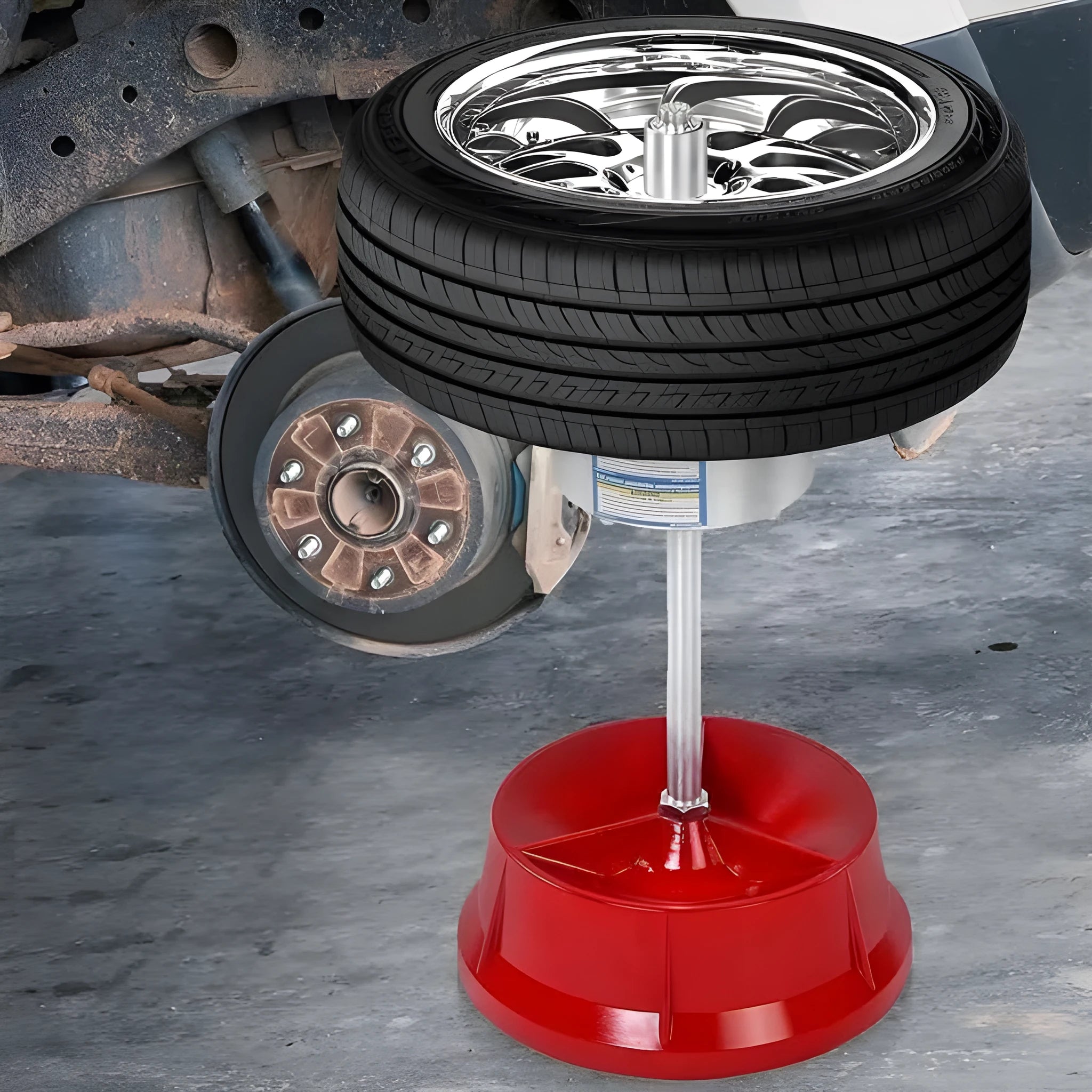 Portable aluminium hub balancer with bull's eye level on a red enamel-finished base.