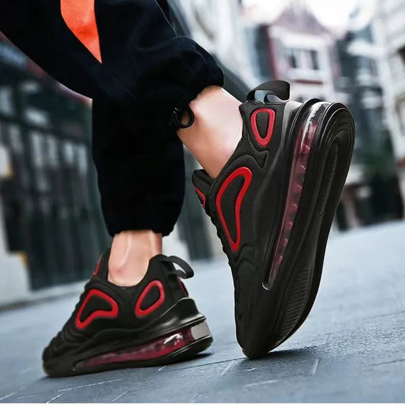 Men's black thick sole lace-up sneakers with a round toe and low-cut design.