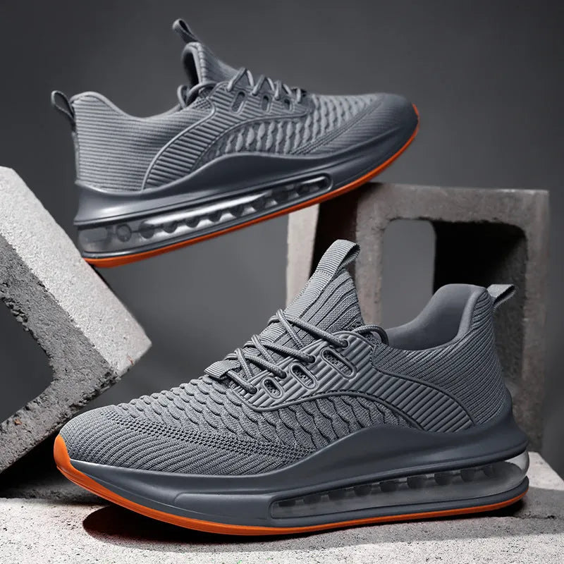 Men's black low-top running shoes with mesh upper and white rubber sole on a plain background.