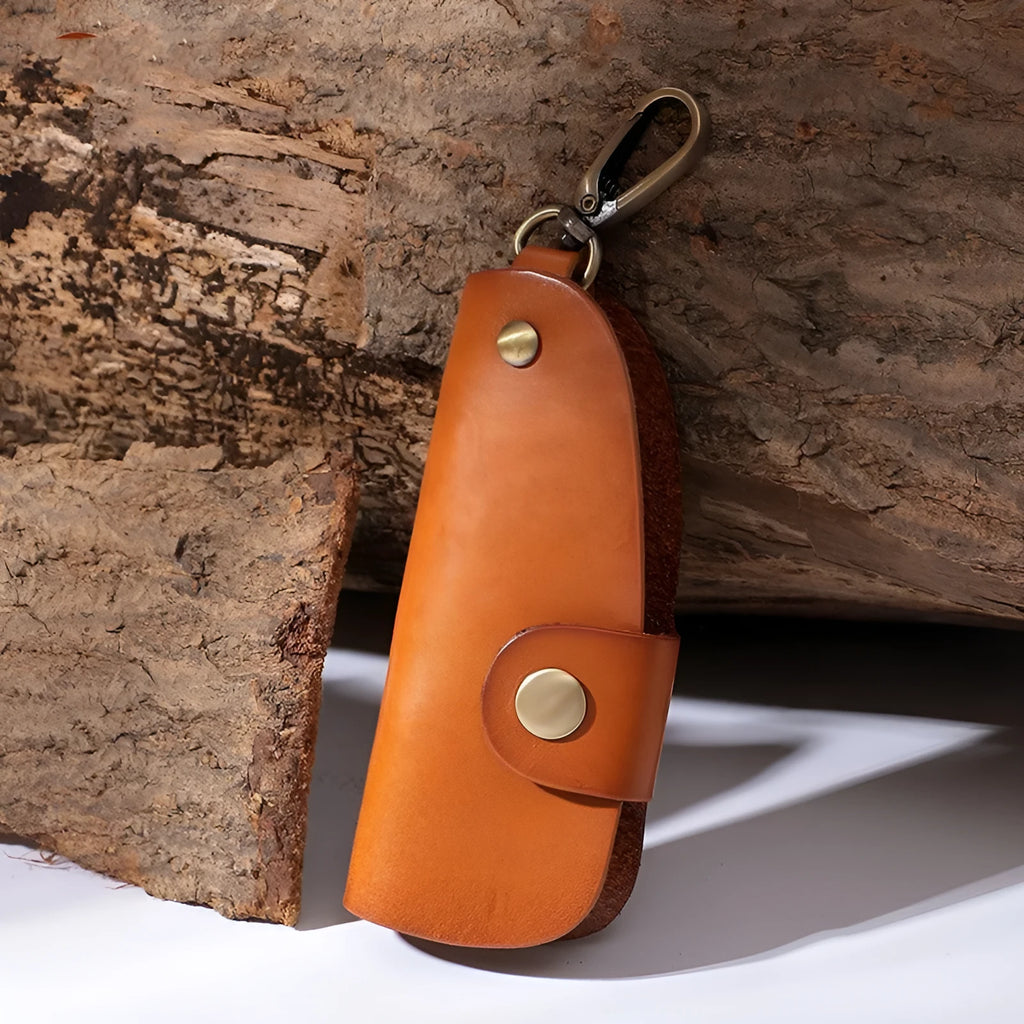 Handmade genuine leather key case for car keys in short length on a table