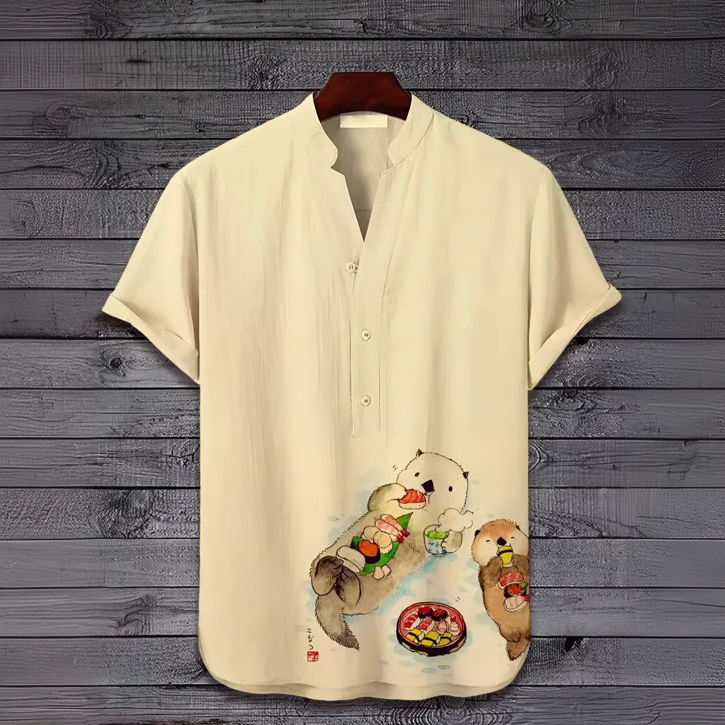Man wearing a short sleeve shirt with a colourful 3D digital animal print design on the front.