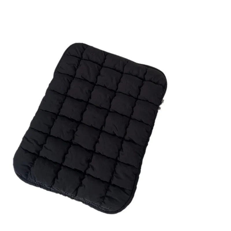 Black and white nylon laptop bag for 11-inch to 15.6-inch devices with large storage capacity.