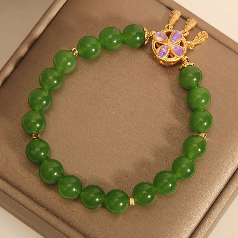 Green jasper bracelet for women with a crystal four-leaf clover dream catcher pendant.