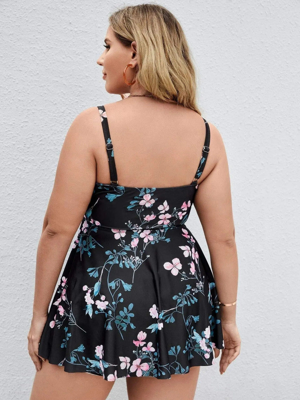 Women's floral print one-piece swimsuit showing split colour design and high elasticity fabric