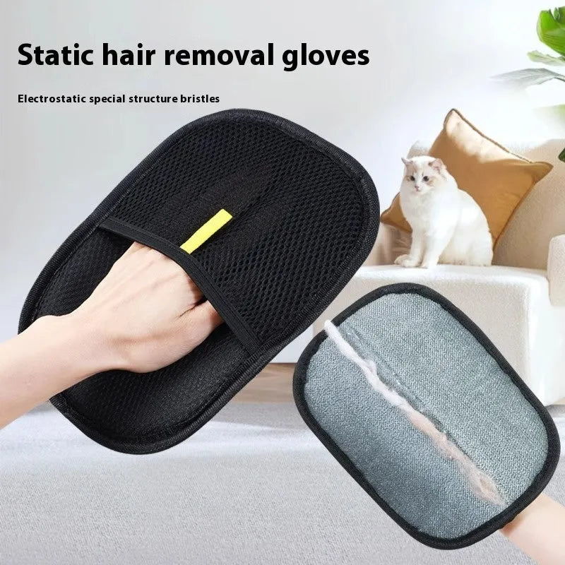 Black pet hair removal glove with silicone bristles, shown on a hand grooming a dog.