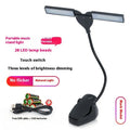 Black USB rechargeable music stand lamp with 28 LEDs mounted on a metal stand.