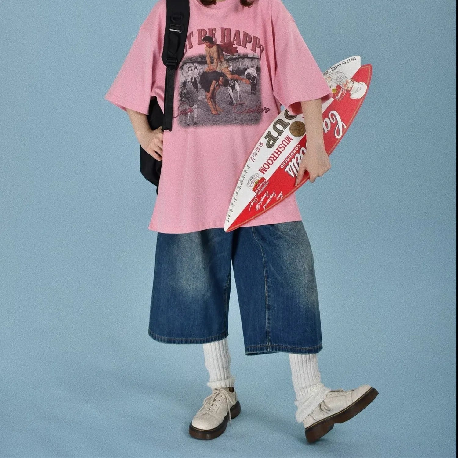 Men's loose straight-cut denim shorts in blue, shown on a hanger.