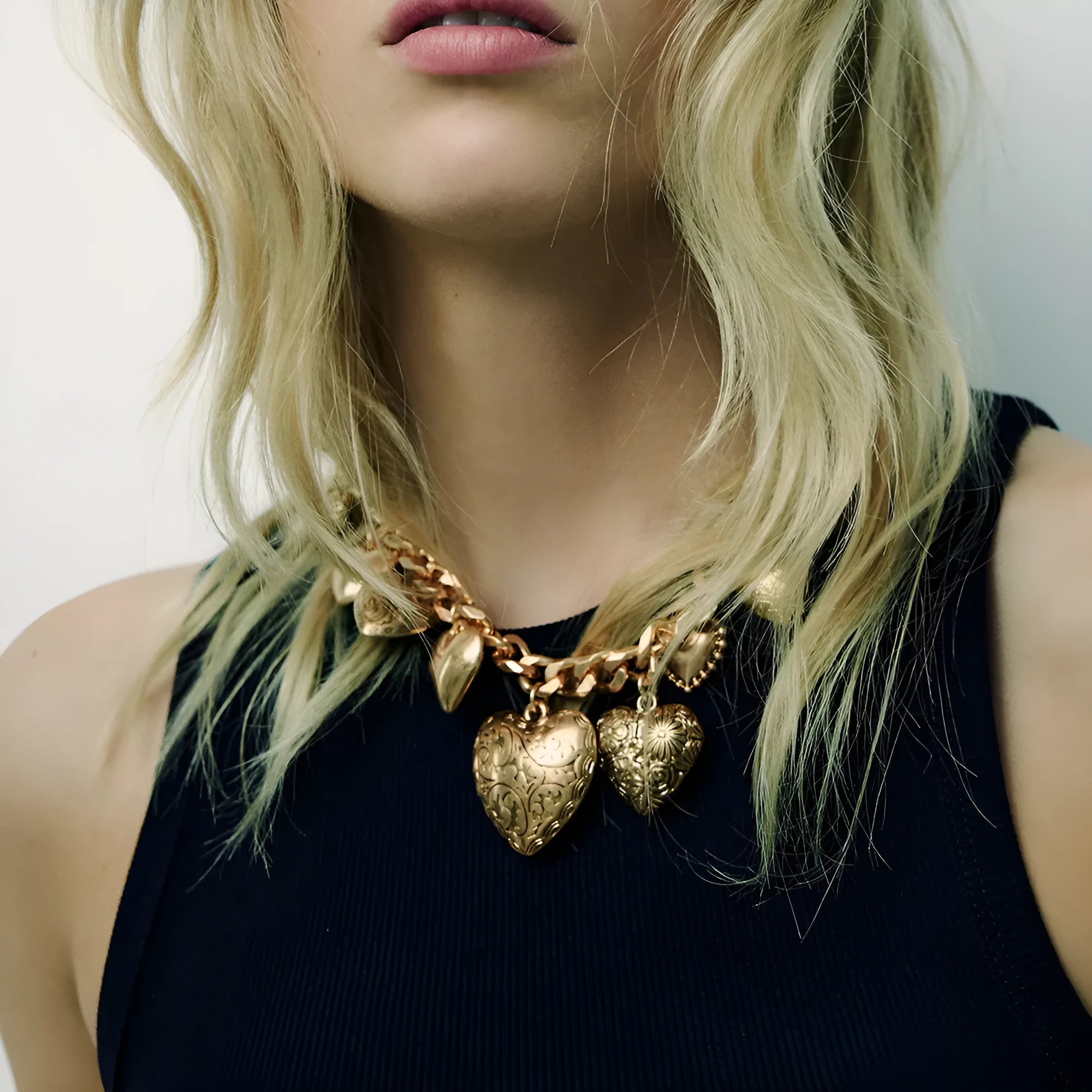 Women's gold carved heart pendant necklace on metal chain with adjustable 41-50cm length