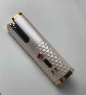 Portable wireless curling iron with USB charging port and gold ceramic barrel in pink colour