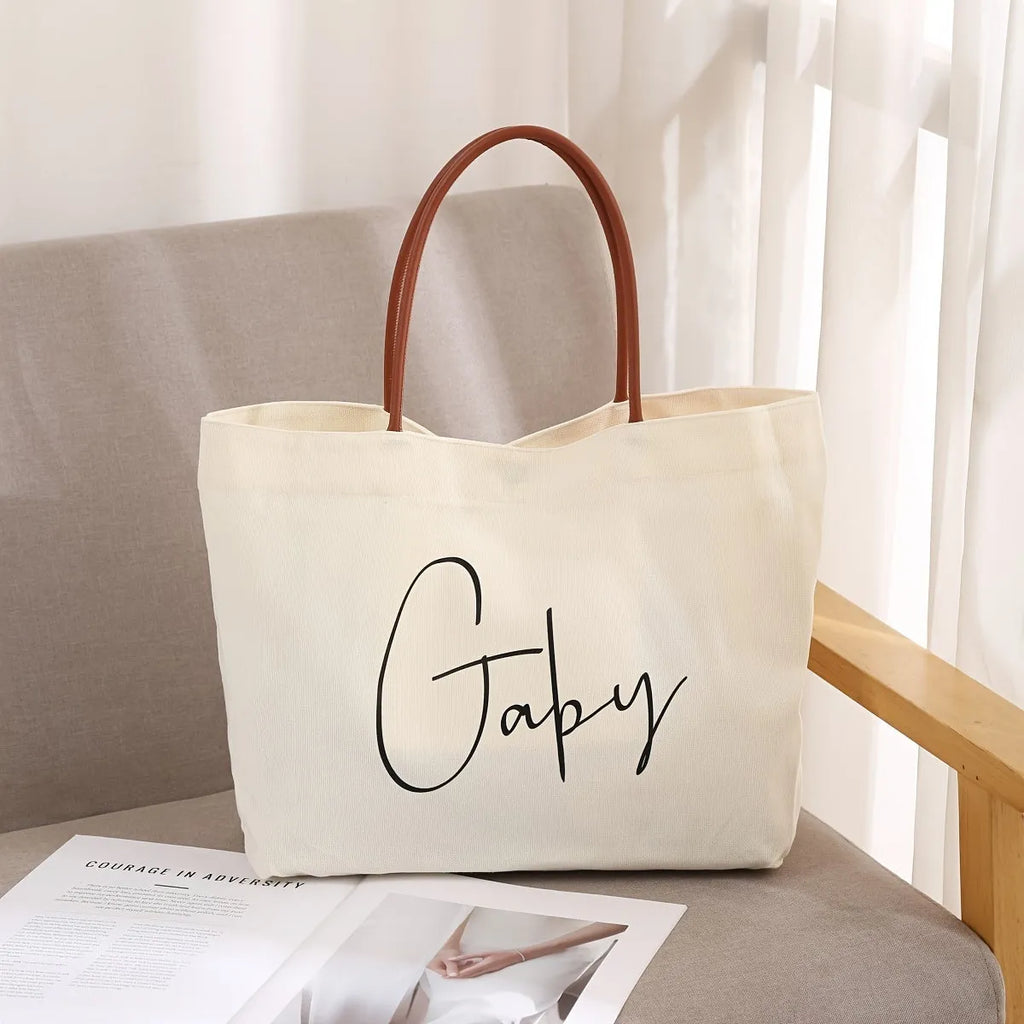Heavy-duty natural canvas tote bag with long straps and reinforced bottom in beige white colour.