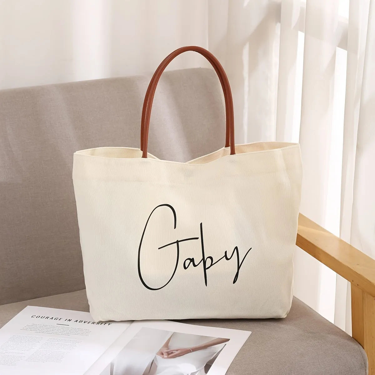Heavy-duty natural canvas tote bag with long straps and reinforced bottom in beige white colour.