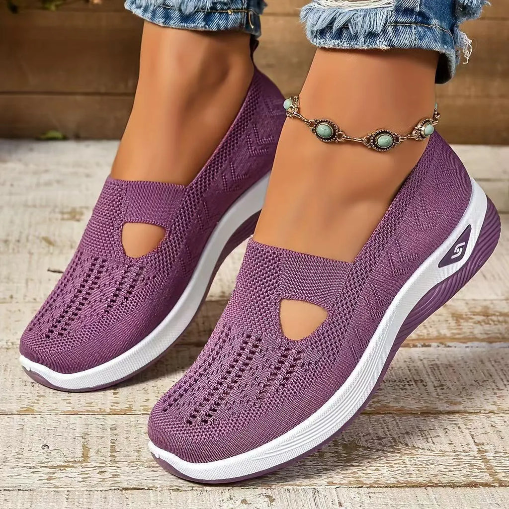 Elderly woman's black mesh T-strap shoe with soft PVC sole and round toe