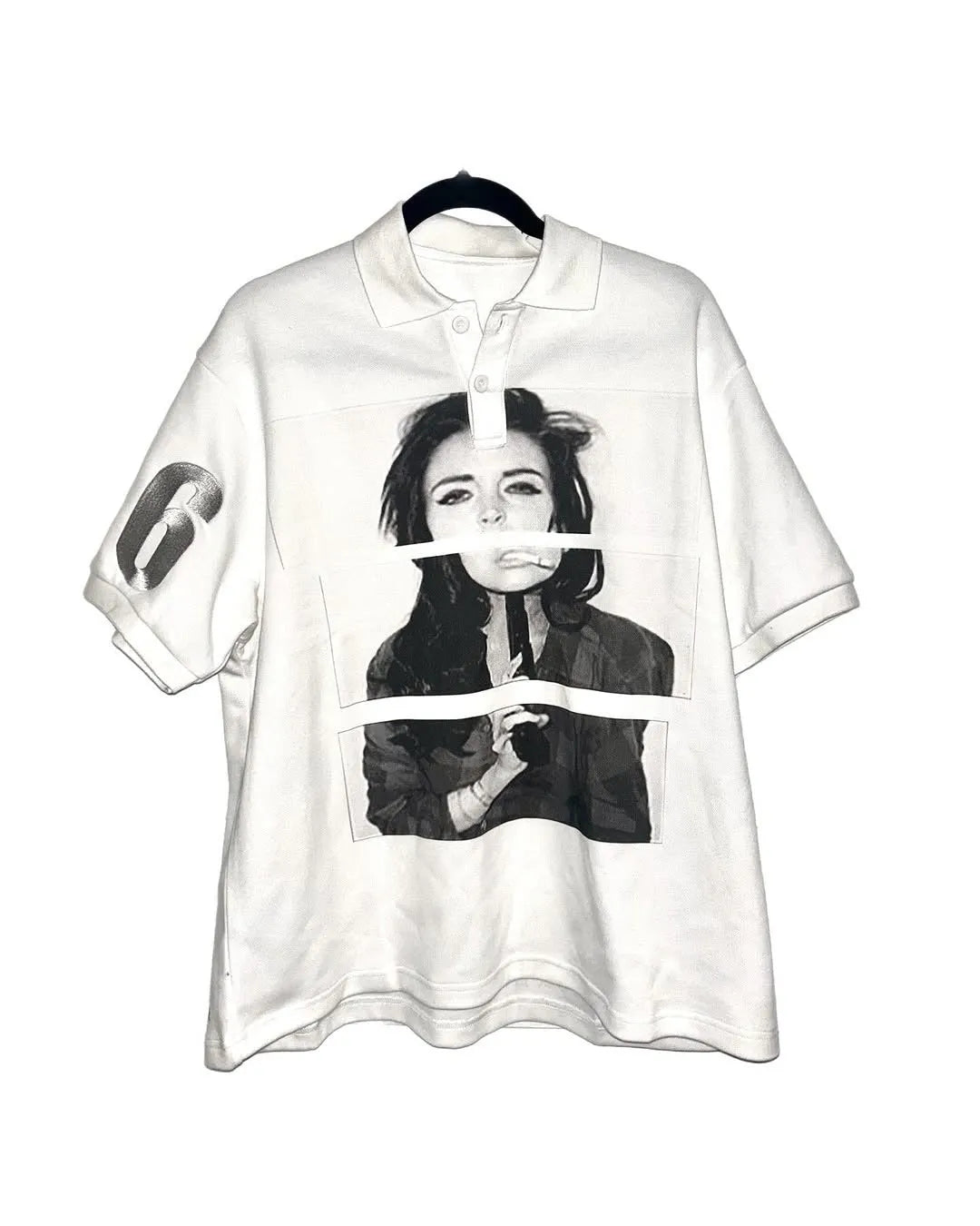 Short-sleeved polyester polo shirt with a printed pattern in a straight, medium-length cut.