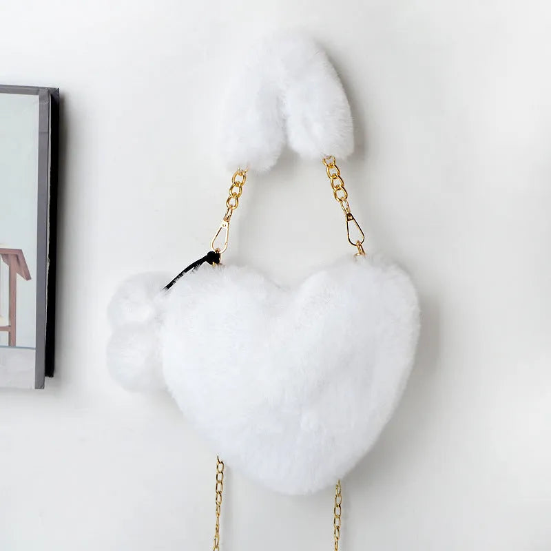 Heart-shaped women's plush handbag with soft texture and detachable shoulder strap in medium size