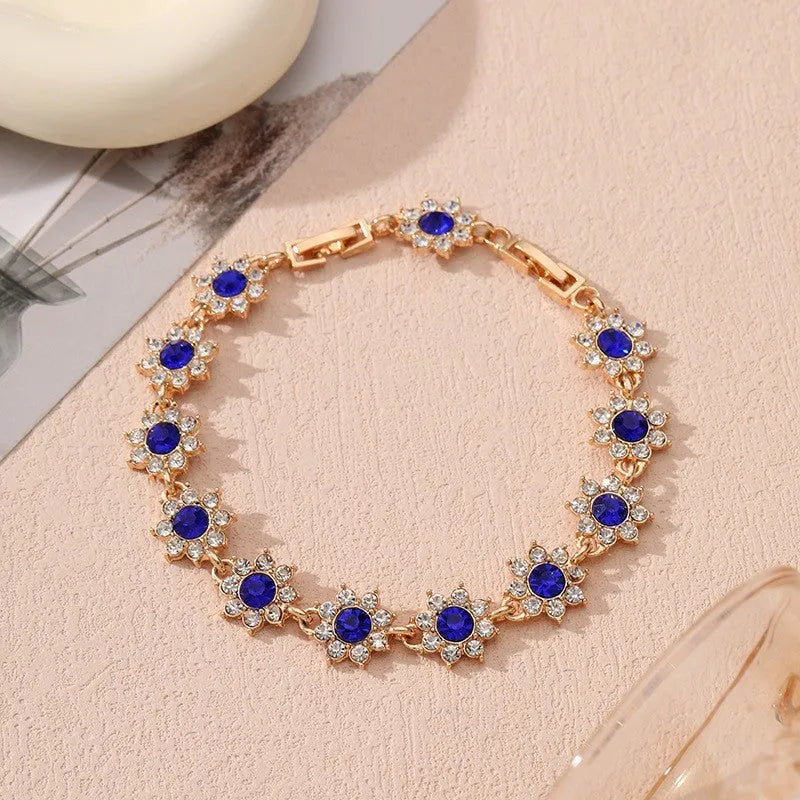Zinc alloy flower bracelet with electroplated colour finish and colourful crystal decorations in gold and silver variations