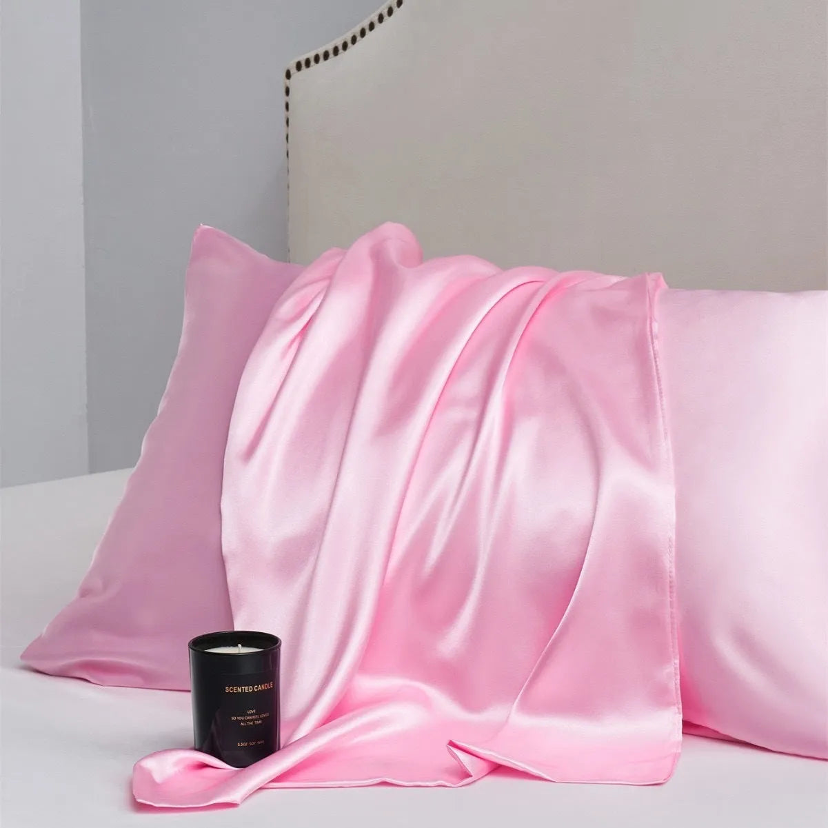 A pair of solid colour satin pillowcases in a chosen shade, showing the smooth plain weave fabric texture.