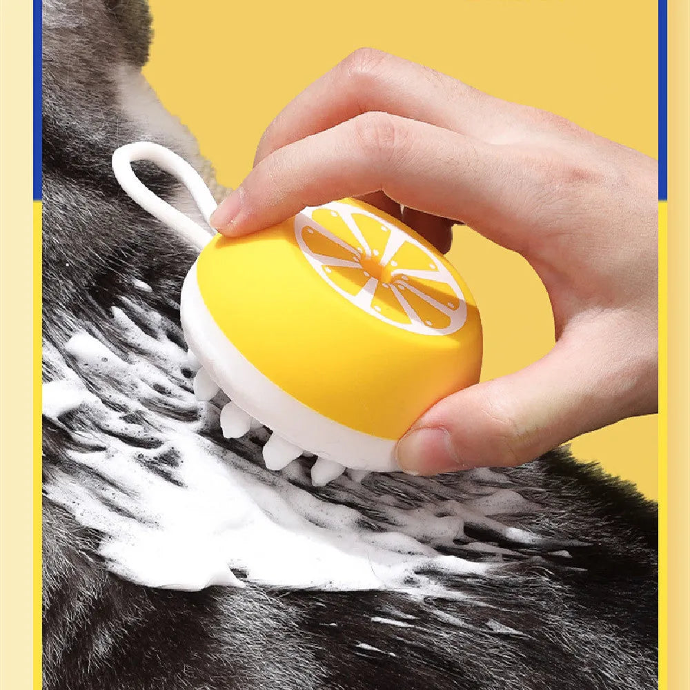 Yellow silicone pet bath brush with massage head for dog and cat grooming during bathing