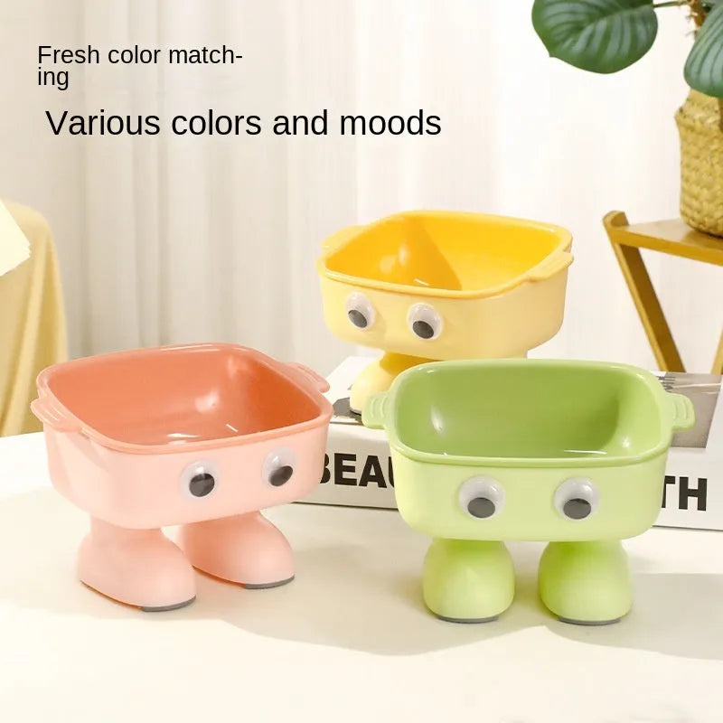 Green robot-shaped elevated cat bowl with tilted design and detachable inner dish