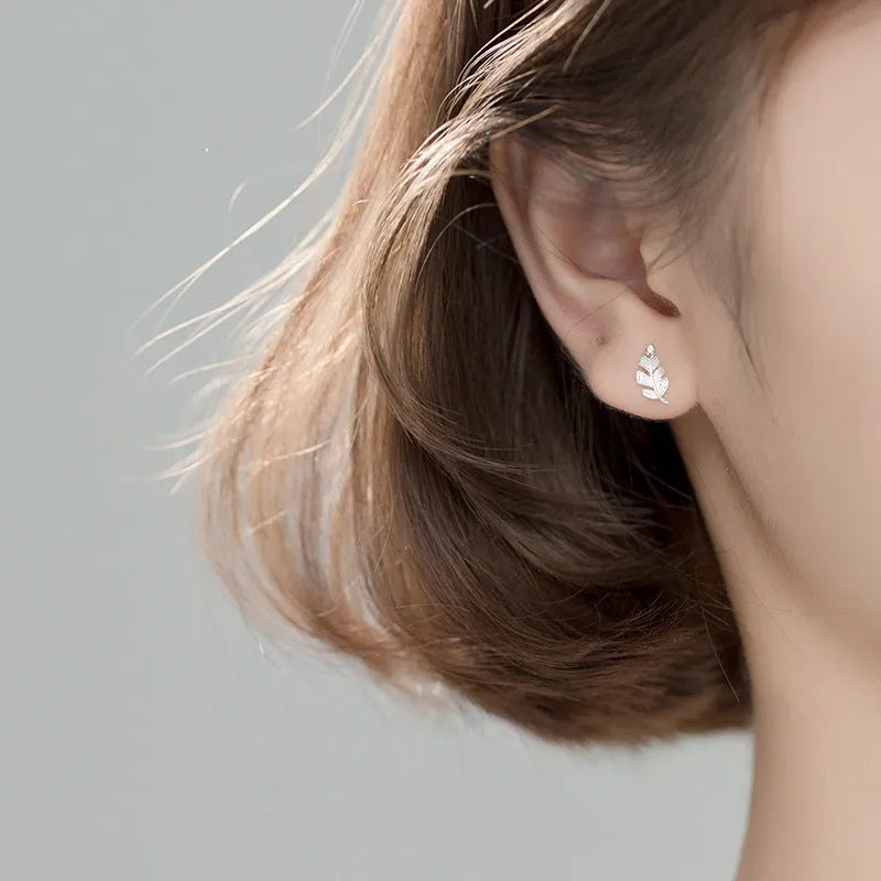Copper willow leaf stud earrings with micro-inlaid leaf detail and geometric Mori style in rose gold and white gold colour
